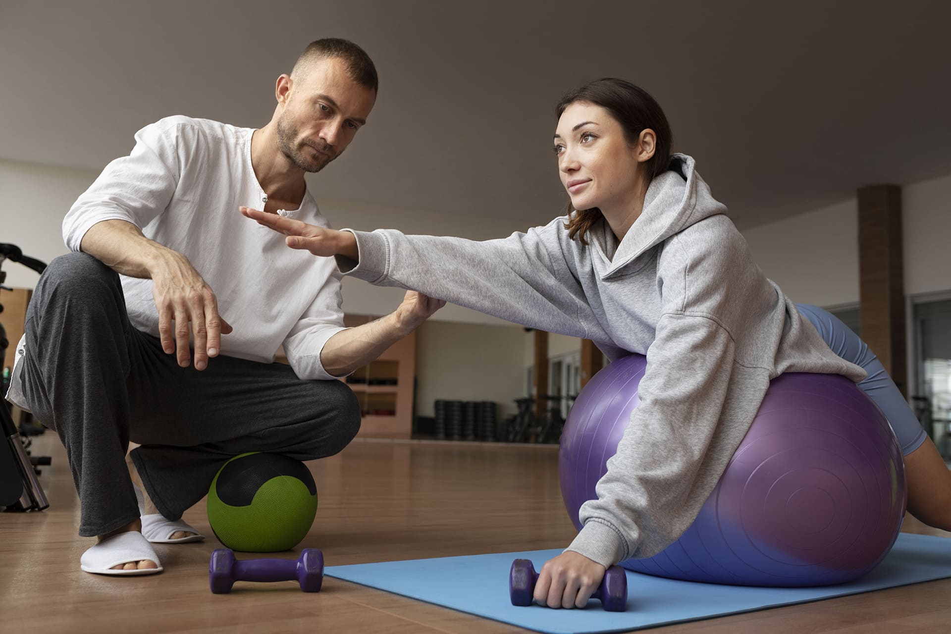 patient-doing-physical-rehabilitation-helped-by-therapists